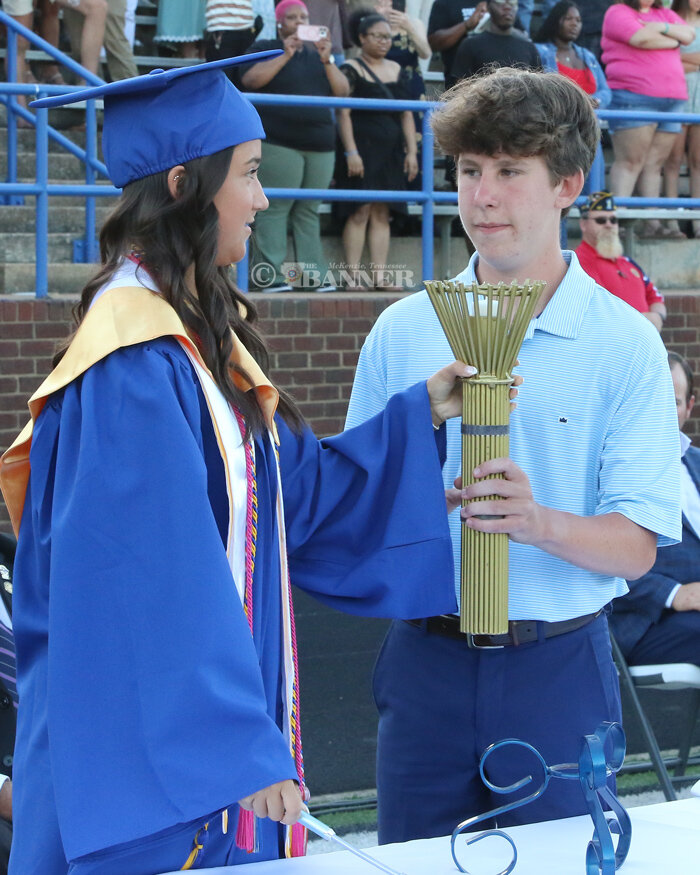 20250520-133324-49c-web2-hhs-pass-torch.jpg