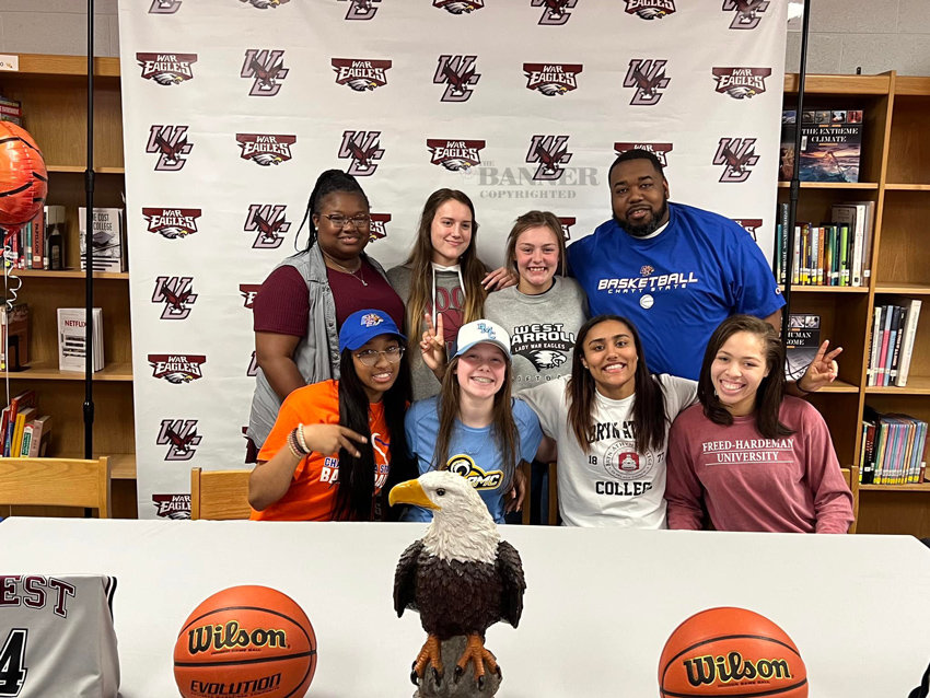 20220426-110302-web-West-Carroll-Signees-With-Coaches.jpg