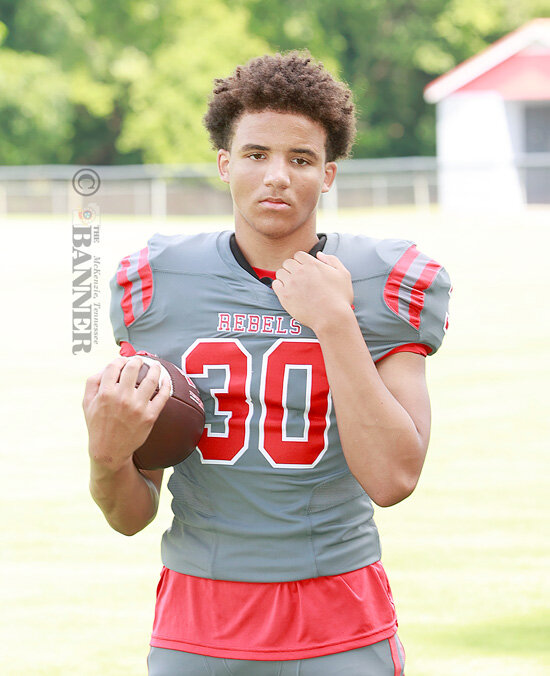 Callis, Rebels Run Rampant Over Trojans, 55-6