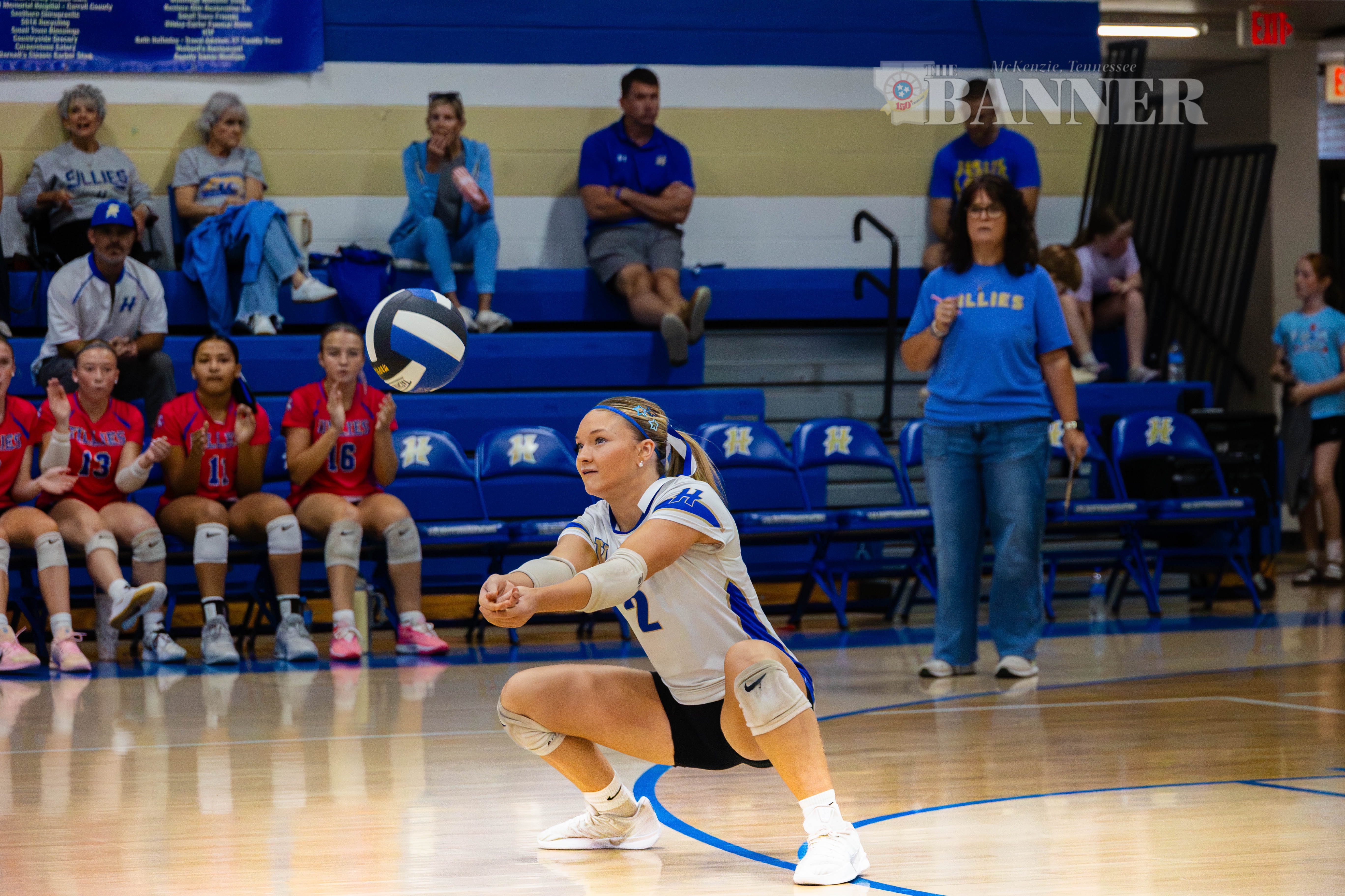 Knox Bennett digs out a serve in region volleyball action